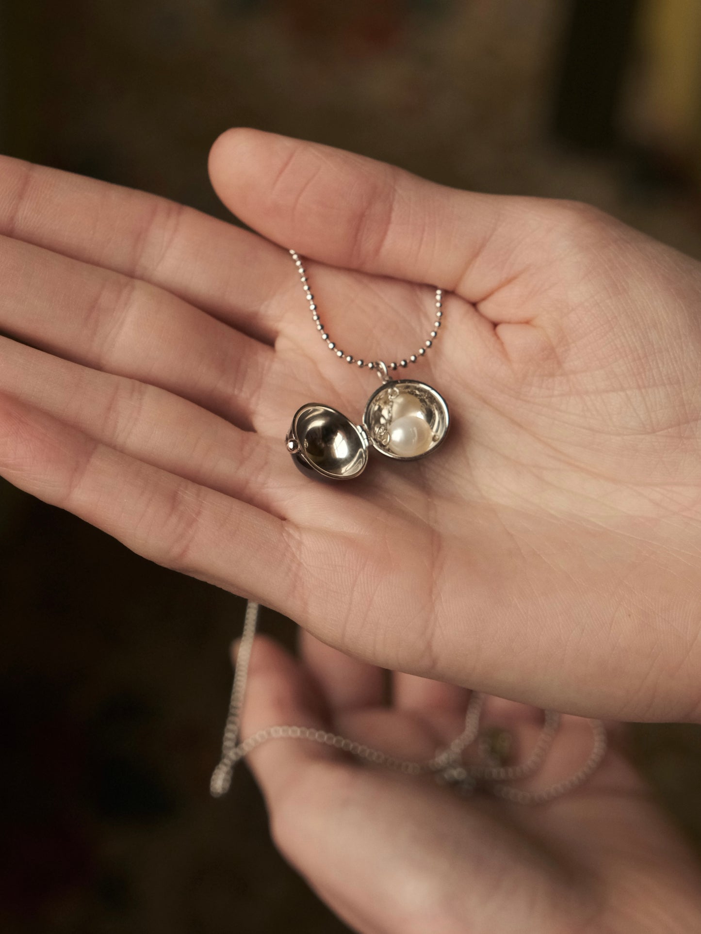 BLACK ENAMEL BALL NECKLACE WITH HIDDEN PEARLS