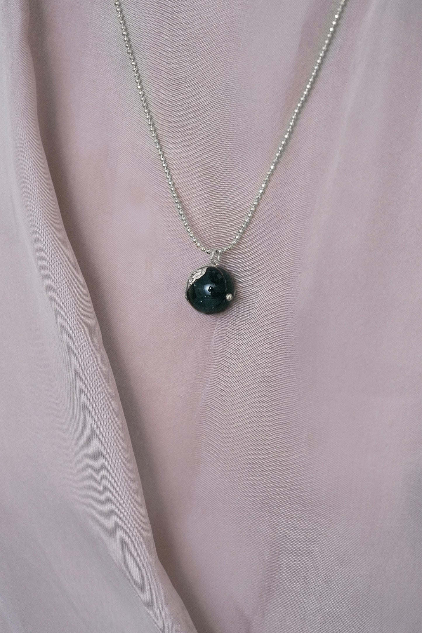 BLACK ENAMEL BALL NECKLACE WITH HIDDEN PEARLS