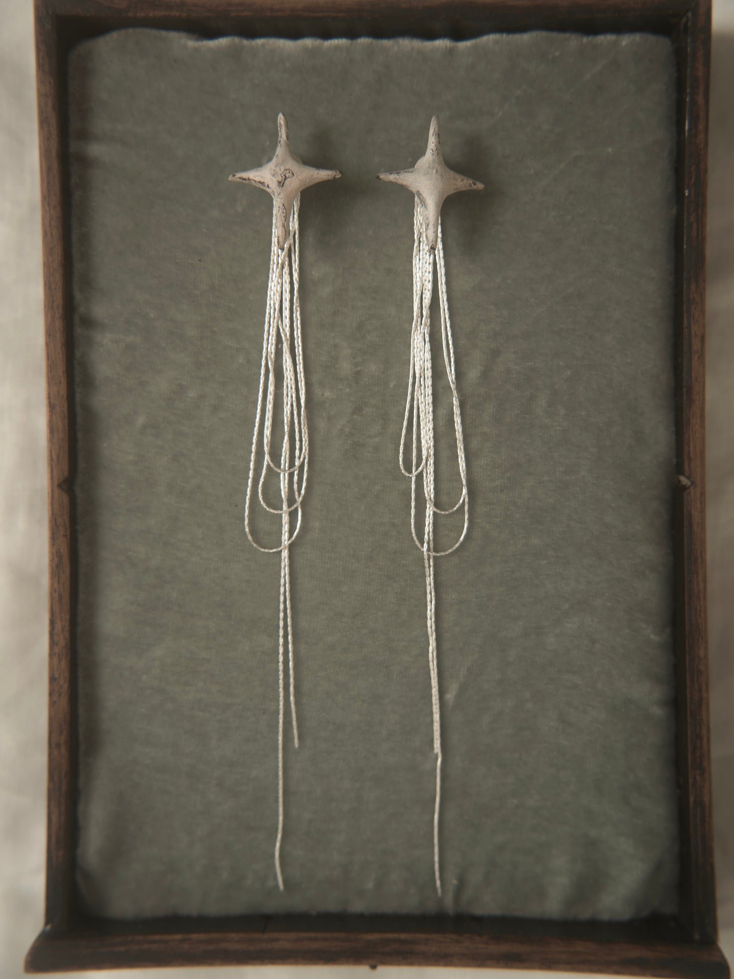 SILVER GLAZED CERAMIC STAR  EARRINGS WITH TASSELS